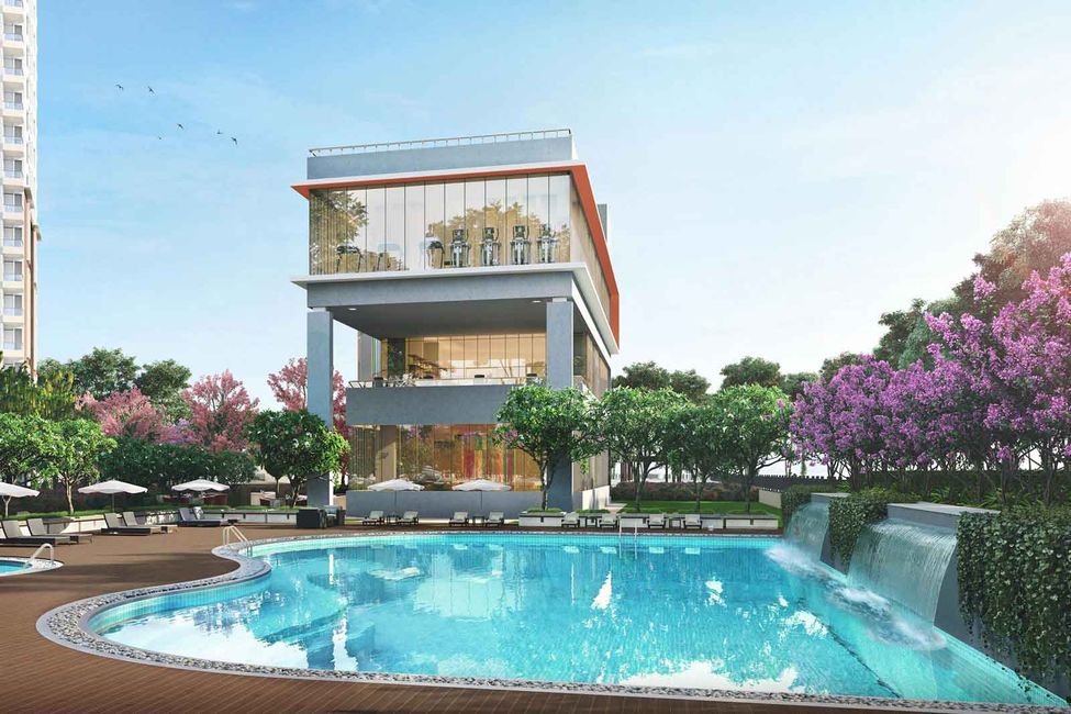 Hero Homes Sector 104 resort-style pool with waterfalls, sun deck, and glass-front fitness centre