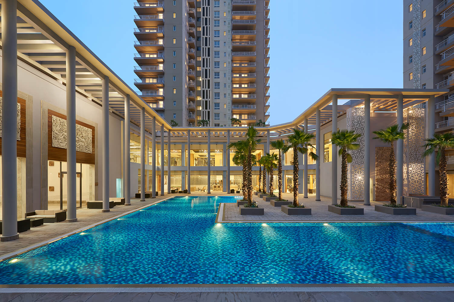 Swimming pool and relaxation deck at Puri Diplomatic Greens Sector 111